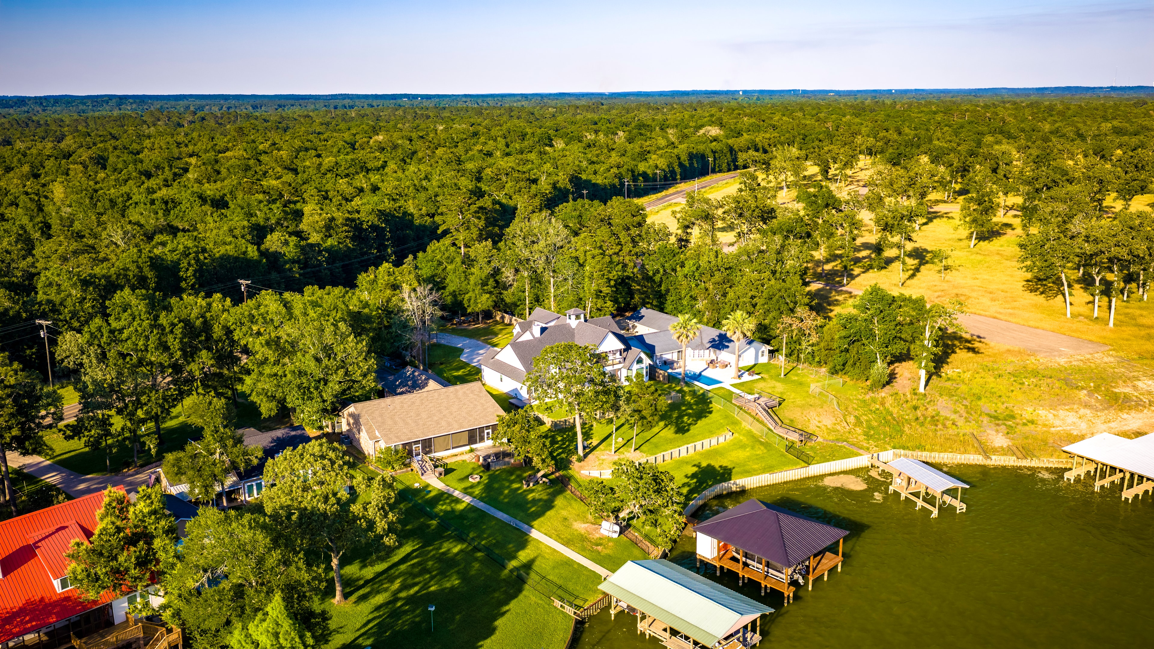 Waterfront estate surrounded by dense forest