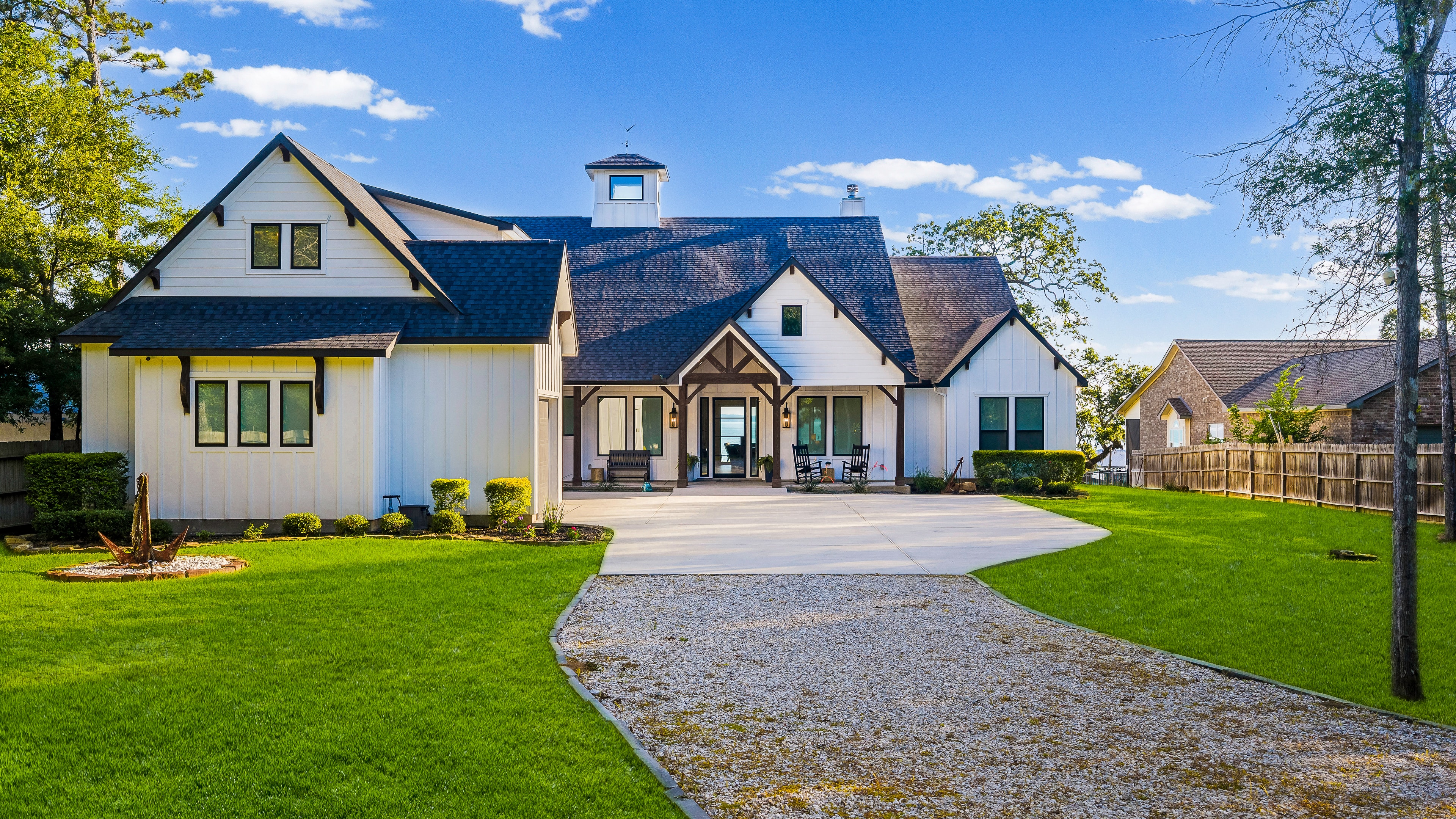 Front exterior with manicured lawn and driveway