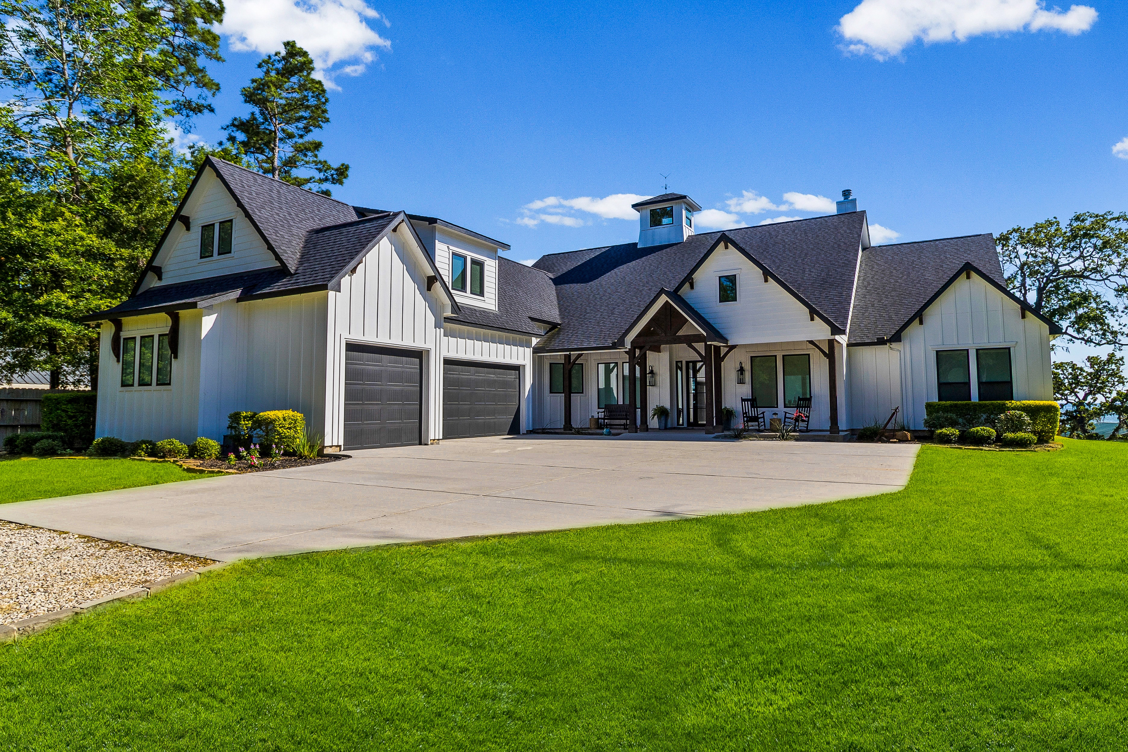 Front of house with manicured lawn