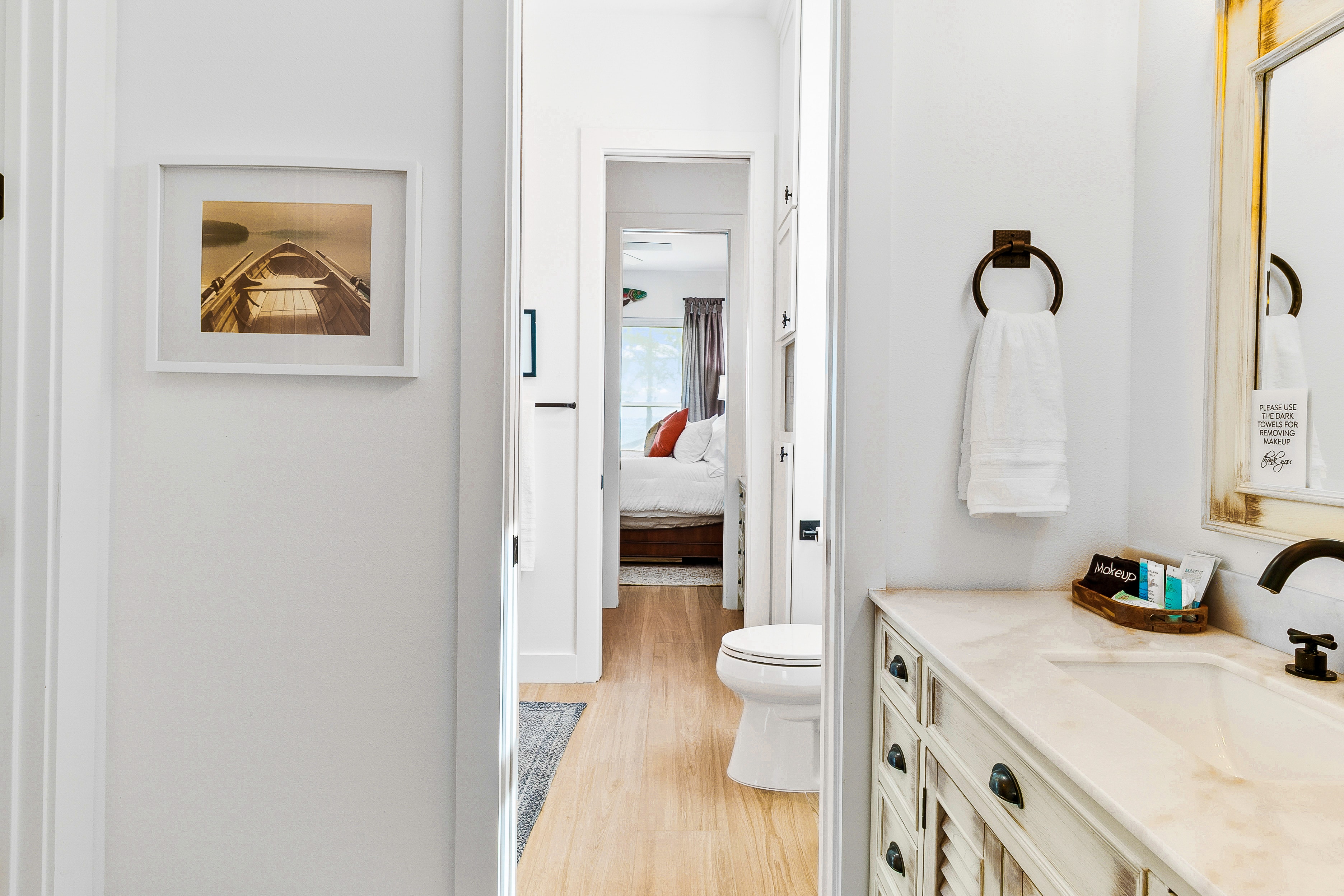 Modern bathroom with coastal bedroom view
