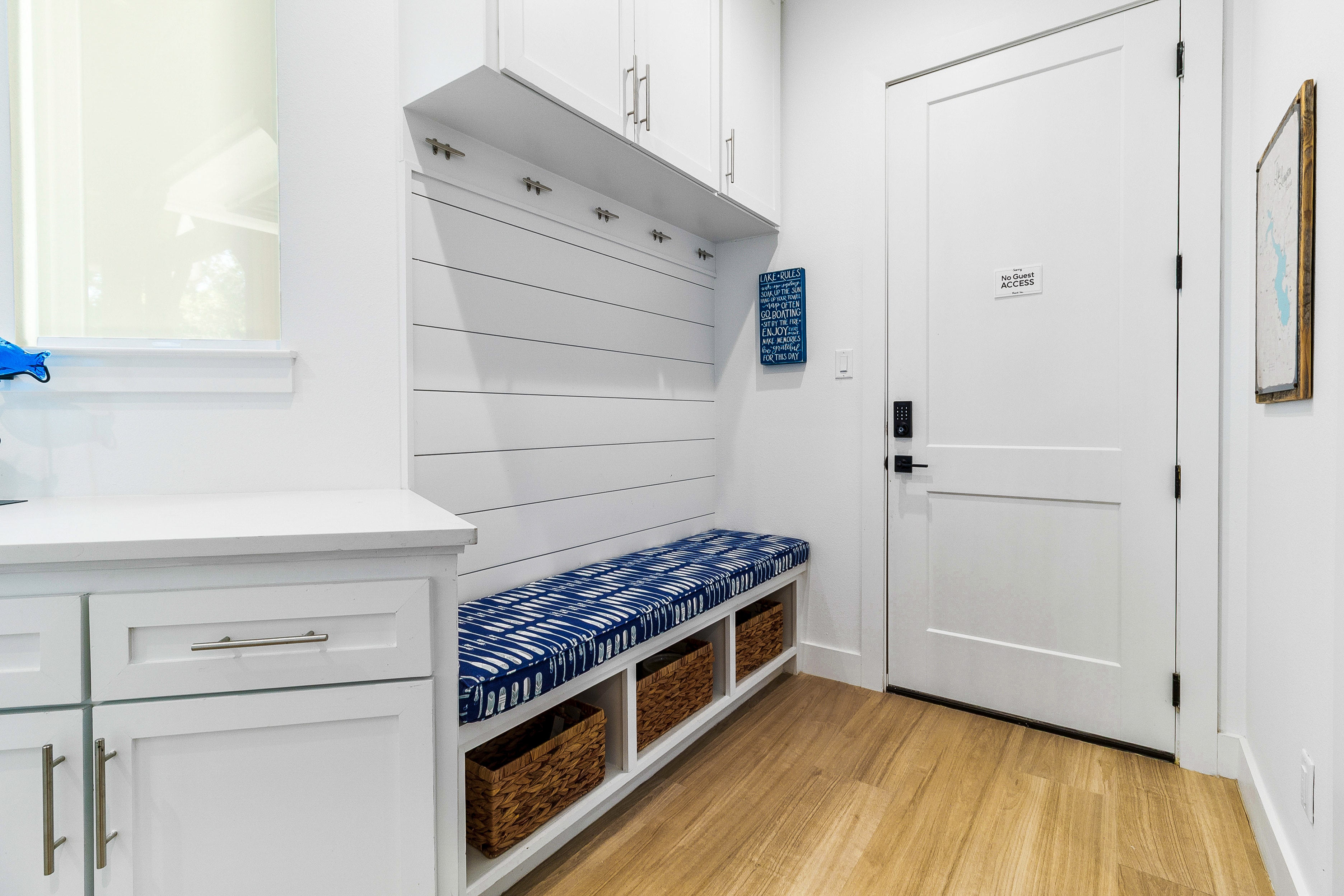 Modern mudroom with storage bench and shelving