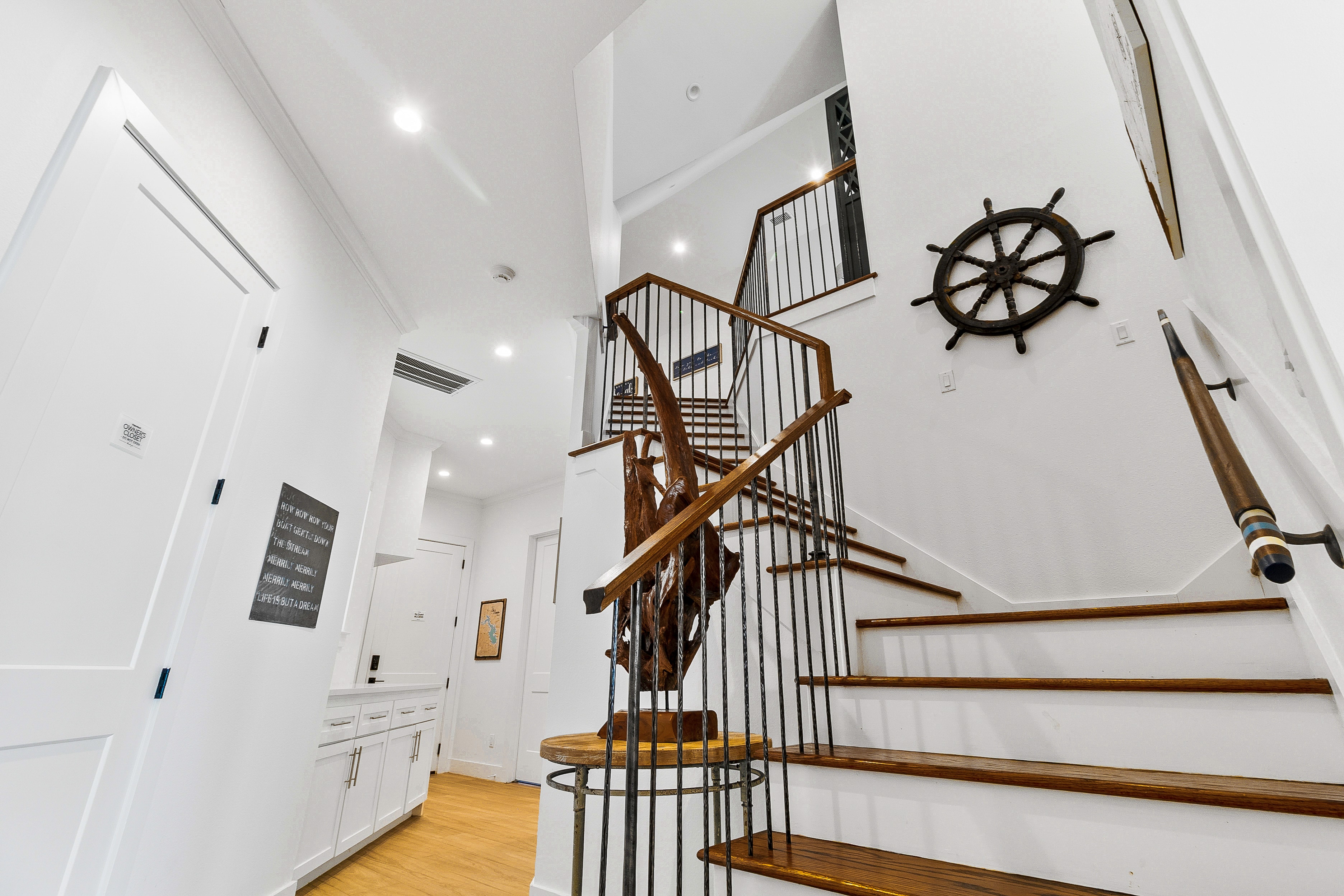 Staircase with nautical ship wheel decor