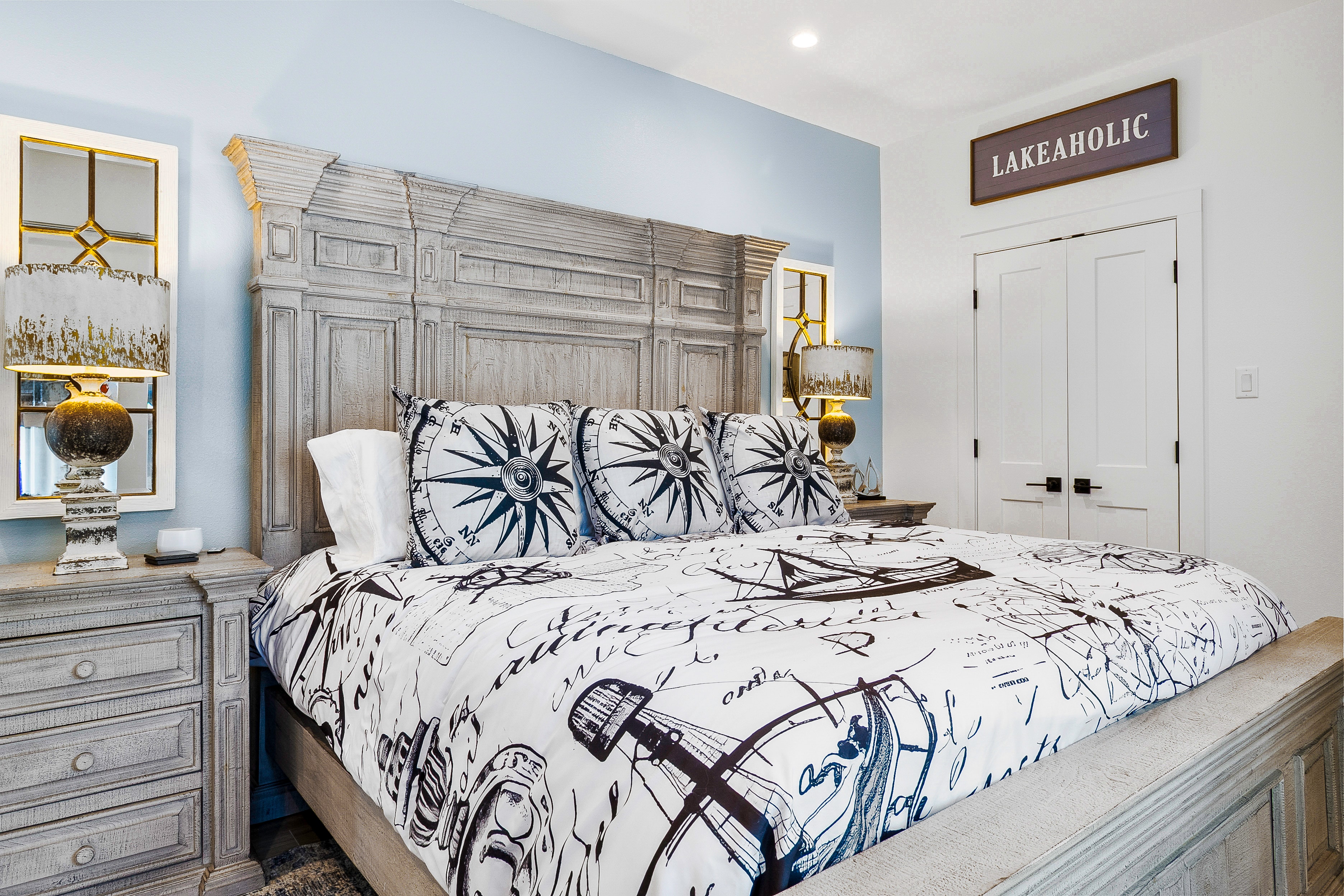 Nautical themed bedroom with compass bedding