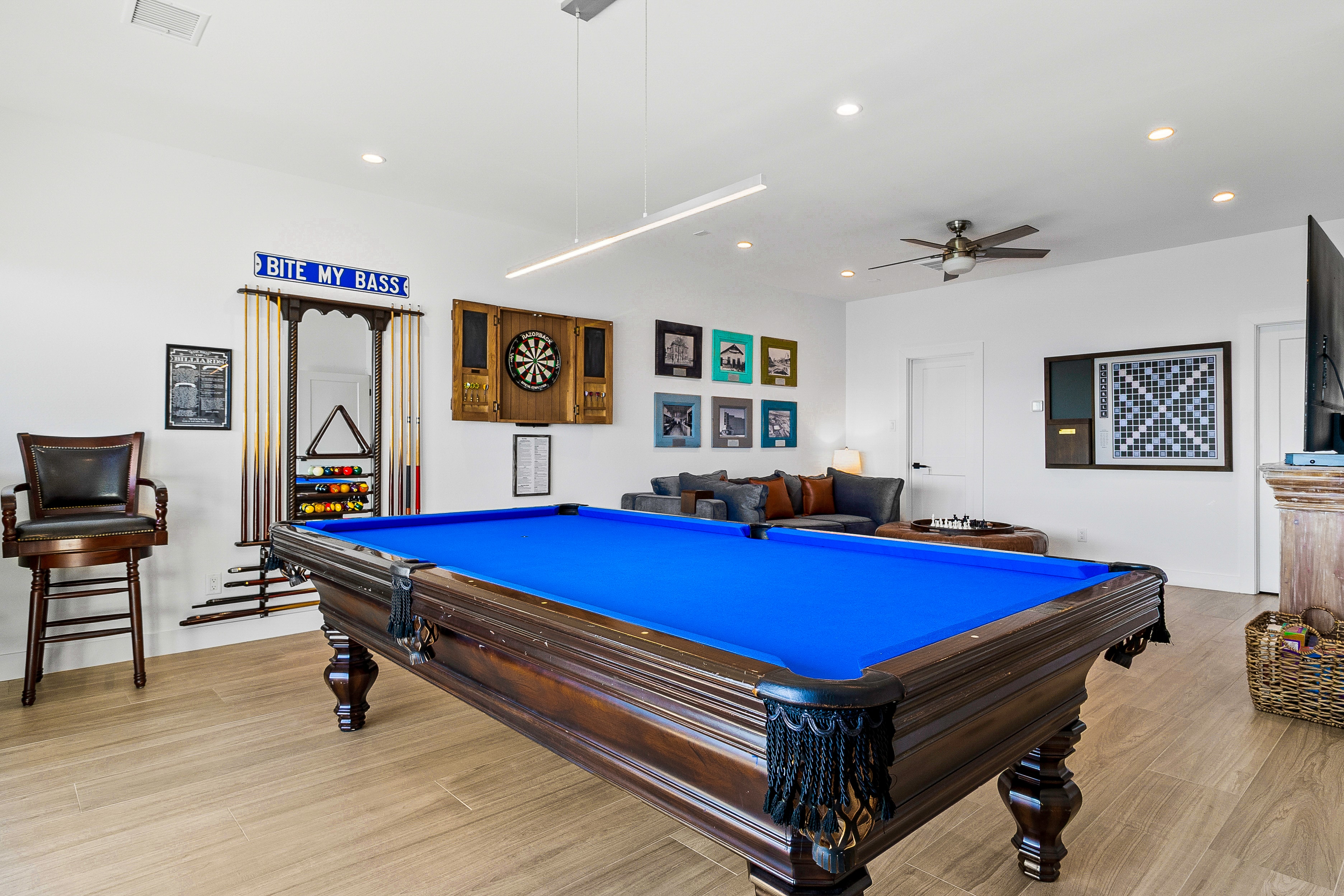 Game room with blue pool table