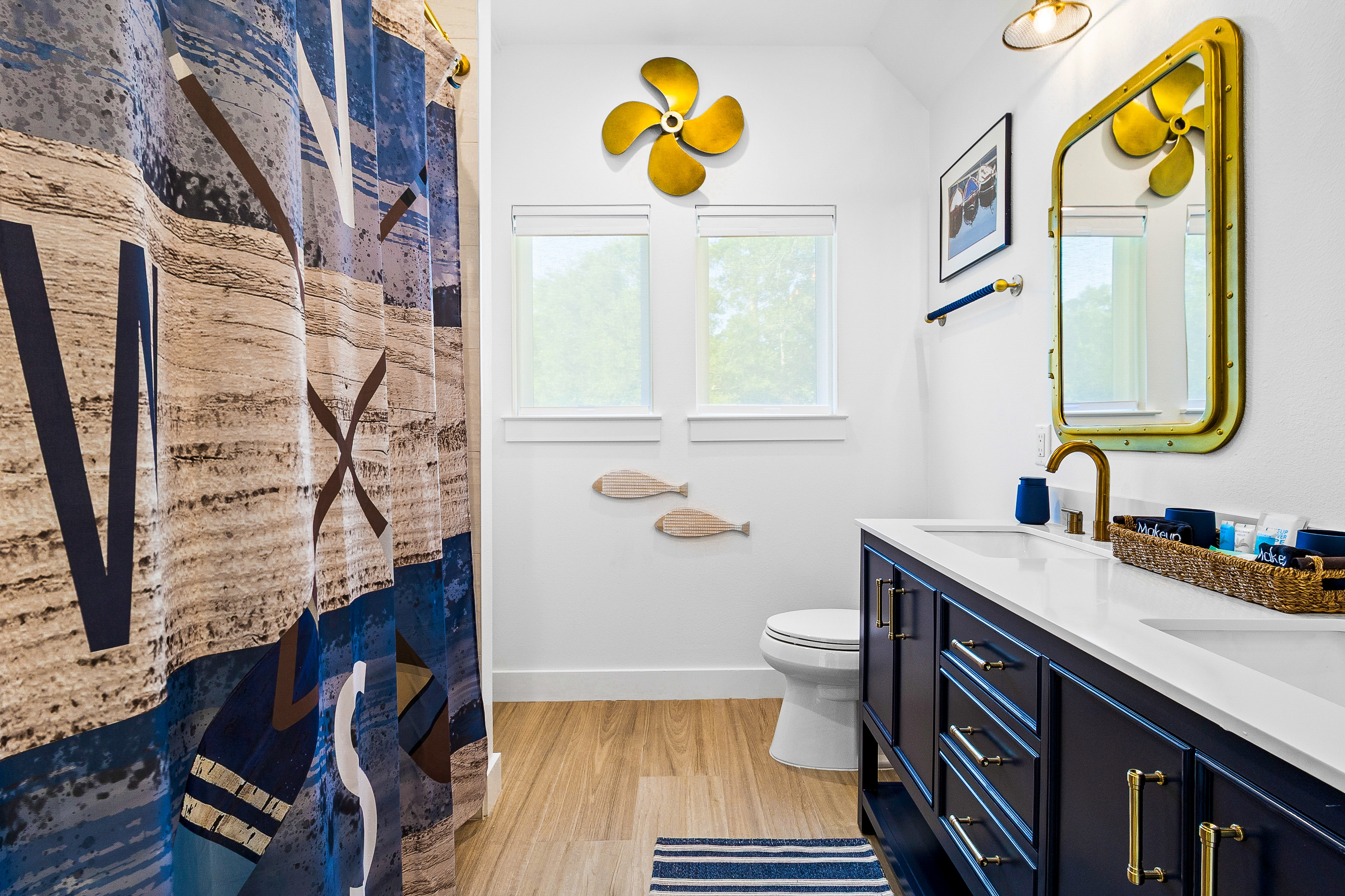 Nautical bathroom with yellow propeller decor