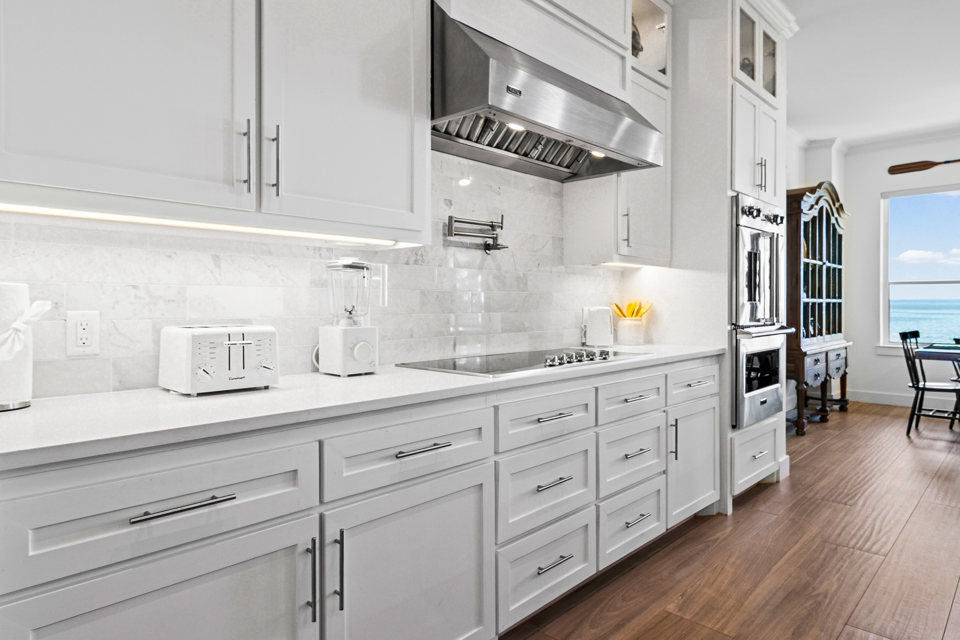 White kitchen with stainless steel appliances