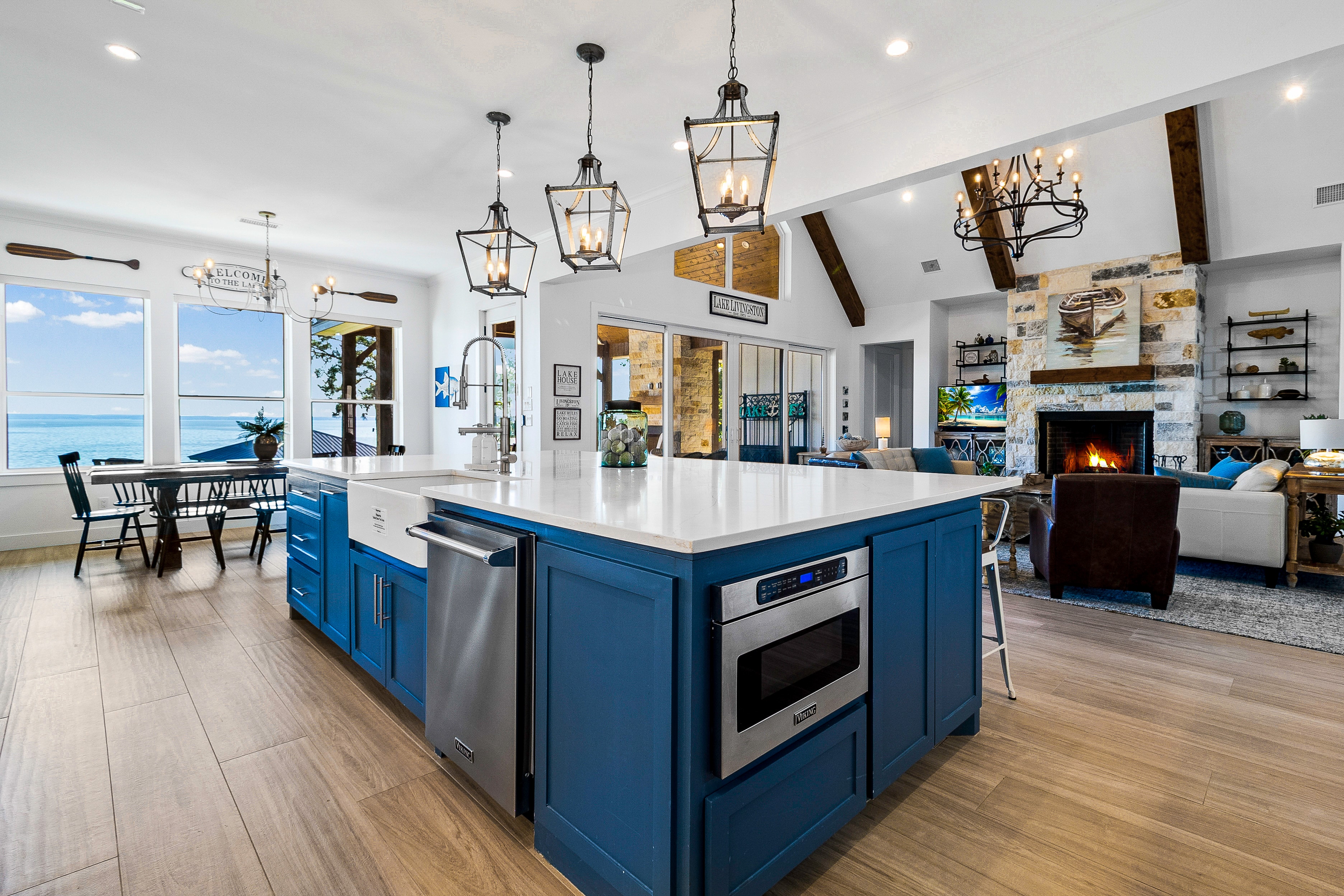 Modern coastal kitchen with blue island