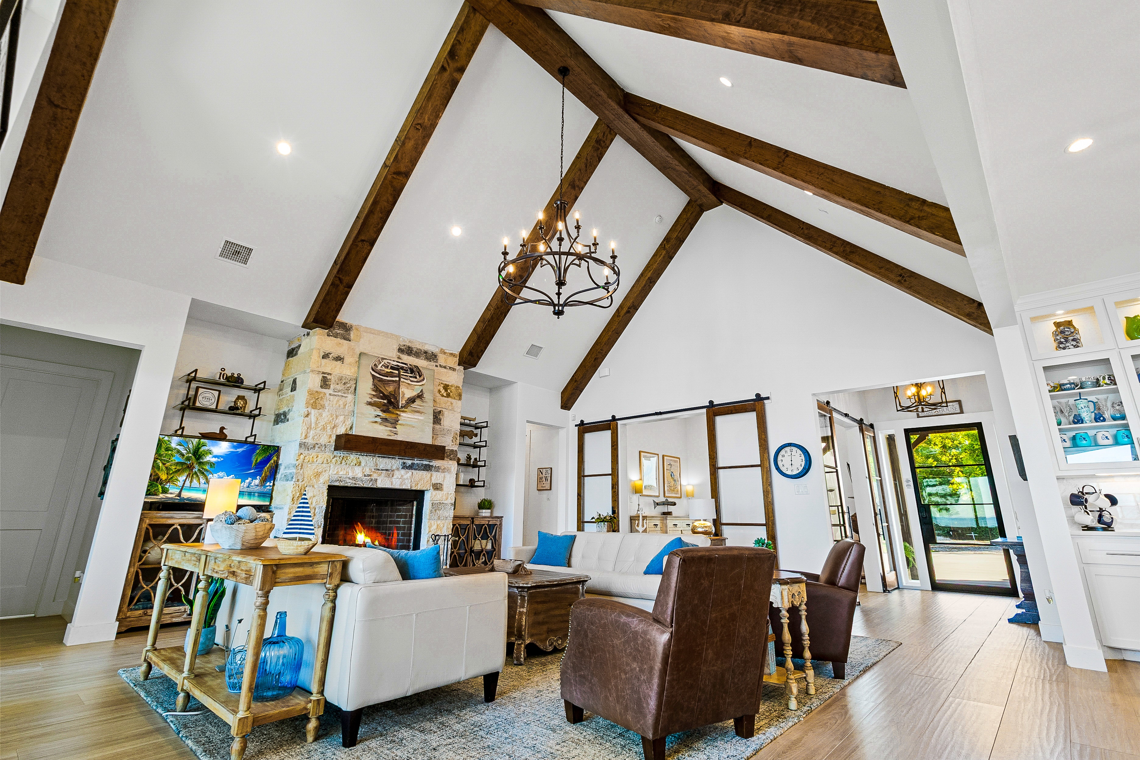 Living room with exposed wood beams and fireplace