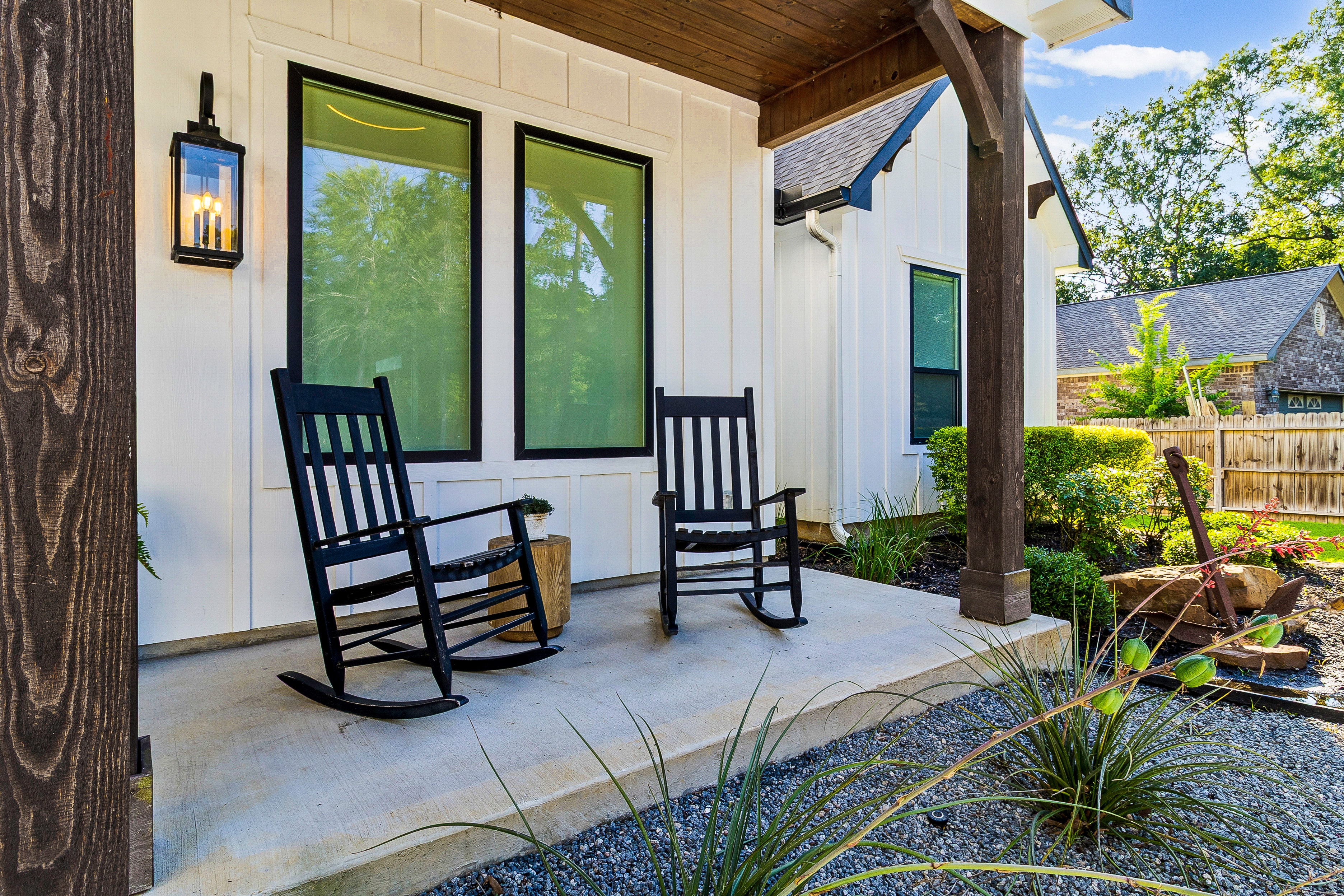Front porch with black rocking chairs