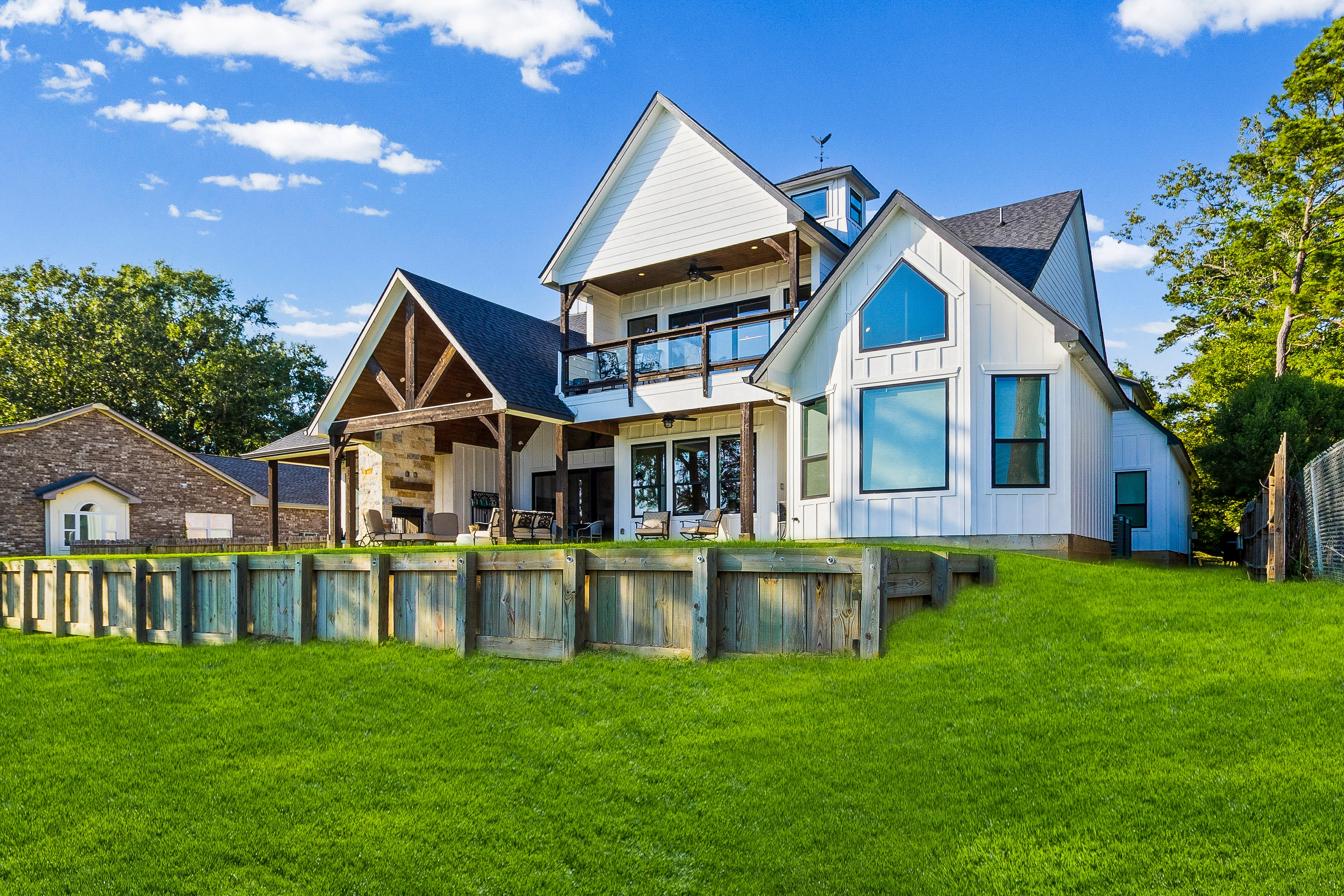 Modern white farmhouse with deck