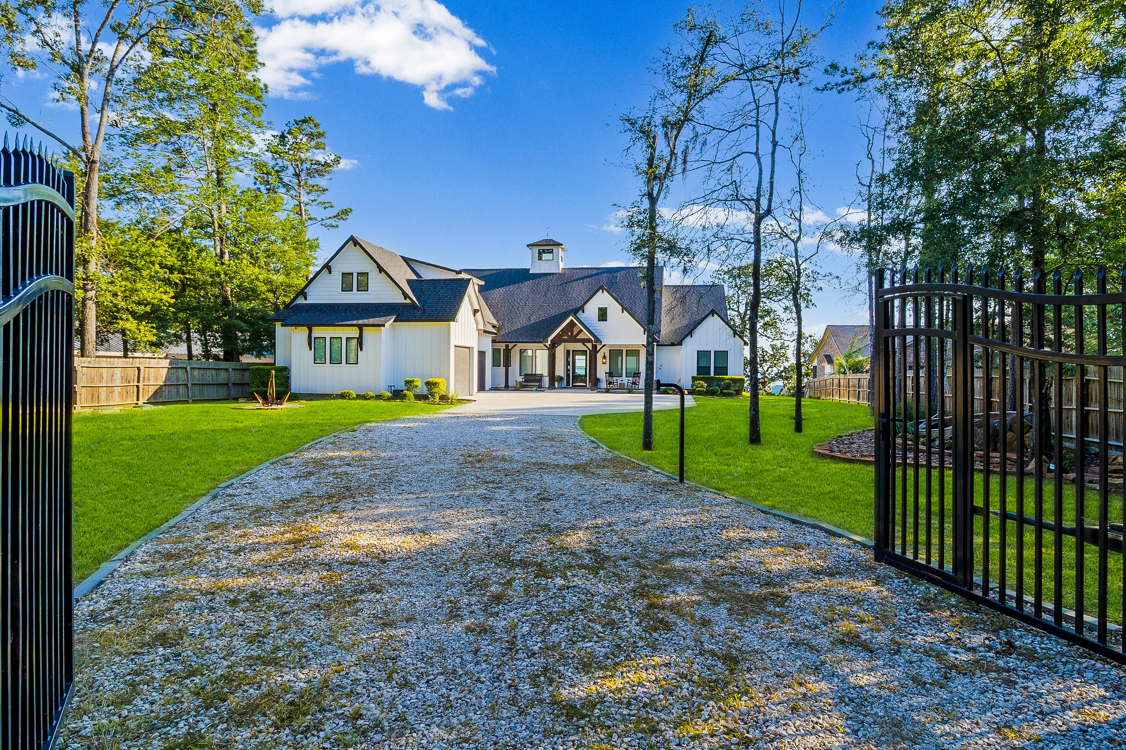 Modern farmhouse exterior with manicured grounds